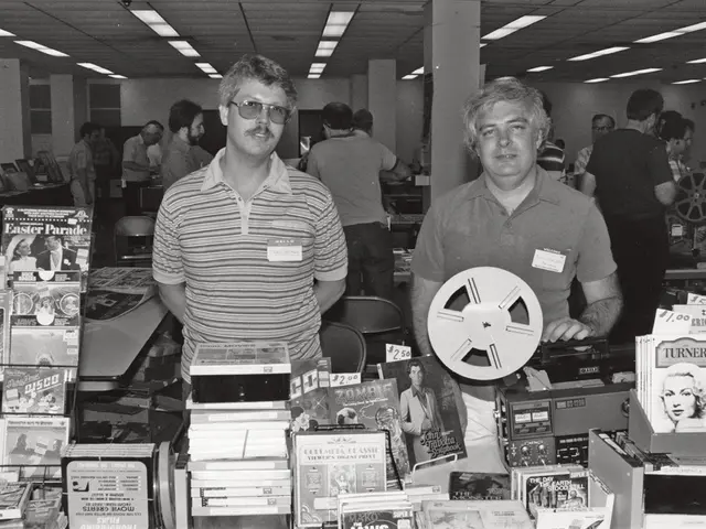 At the bottom of the image there are many books and also there is a tape recorder. On the left side...