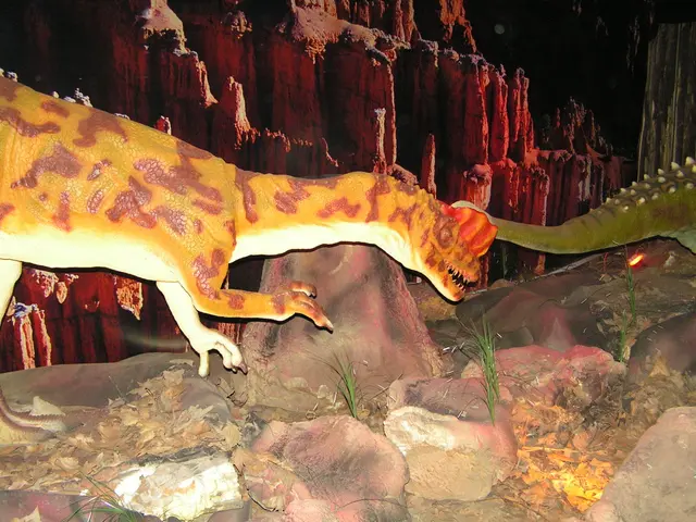 In this picture we can observe a dinosaur which is in yellow and maroon color. There are some...
