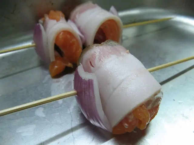 In the picture there are food items present to the sticks.